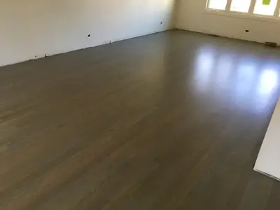 gallery17 Hardwood floor refinishing in Chicago — Red Oak stained grey brown, satin finish, empty room after refinishing