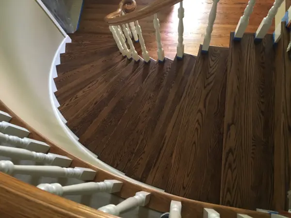 Curved staircase refinishing and repair – Kenilworth | FLOORecki Floors & Stairs Curved staircase refinished and repaired in a Kenilworth home