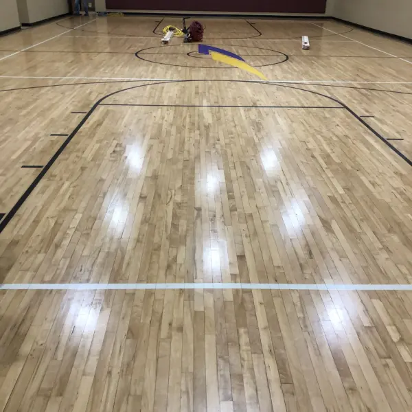 Water damaged maple hardwood basketball court before repair Chicago FLOORecki