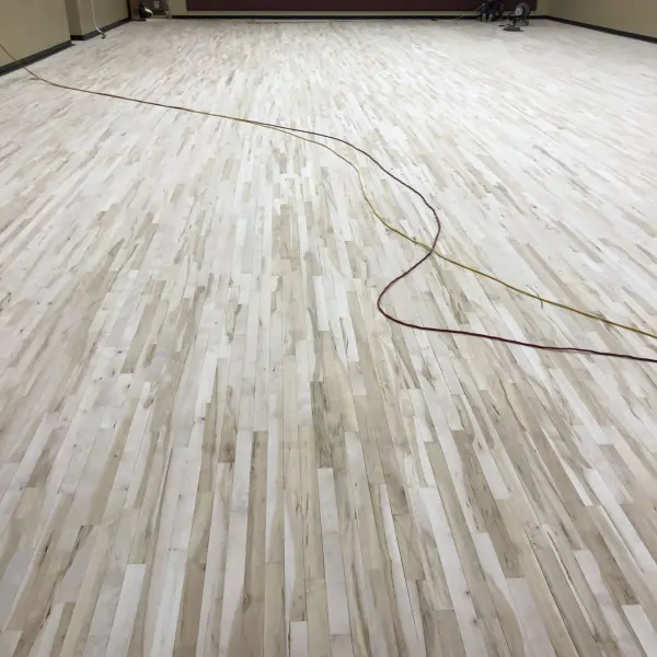 Maple hardwood floor section replacement commercial gym Chicago FLOORecki