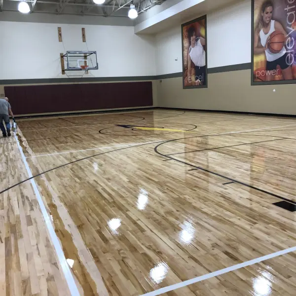 Professional gym hardwood floor sanding and refinishing at LA Fitness Chicago — FLOORecki 