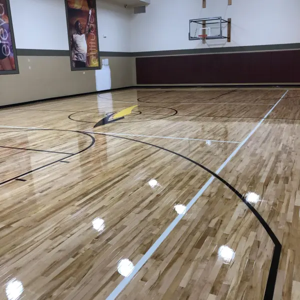 Award winning completed LA Fitness basketball court hardwood floor restoration Chicago