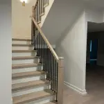 White oak staircase installation with modern square design and iron spindles in Chicago home by FLOORecki Floors & Stairs 