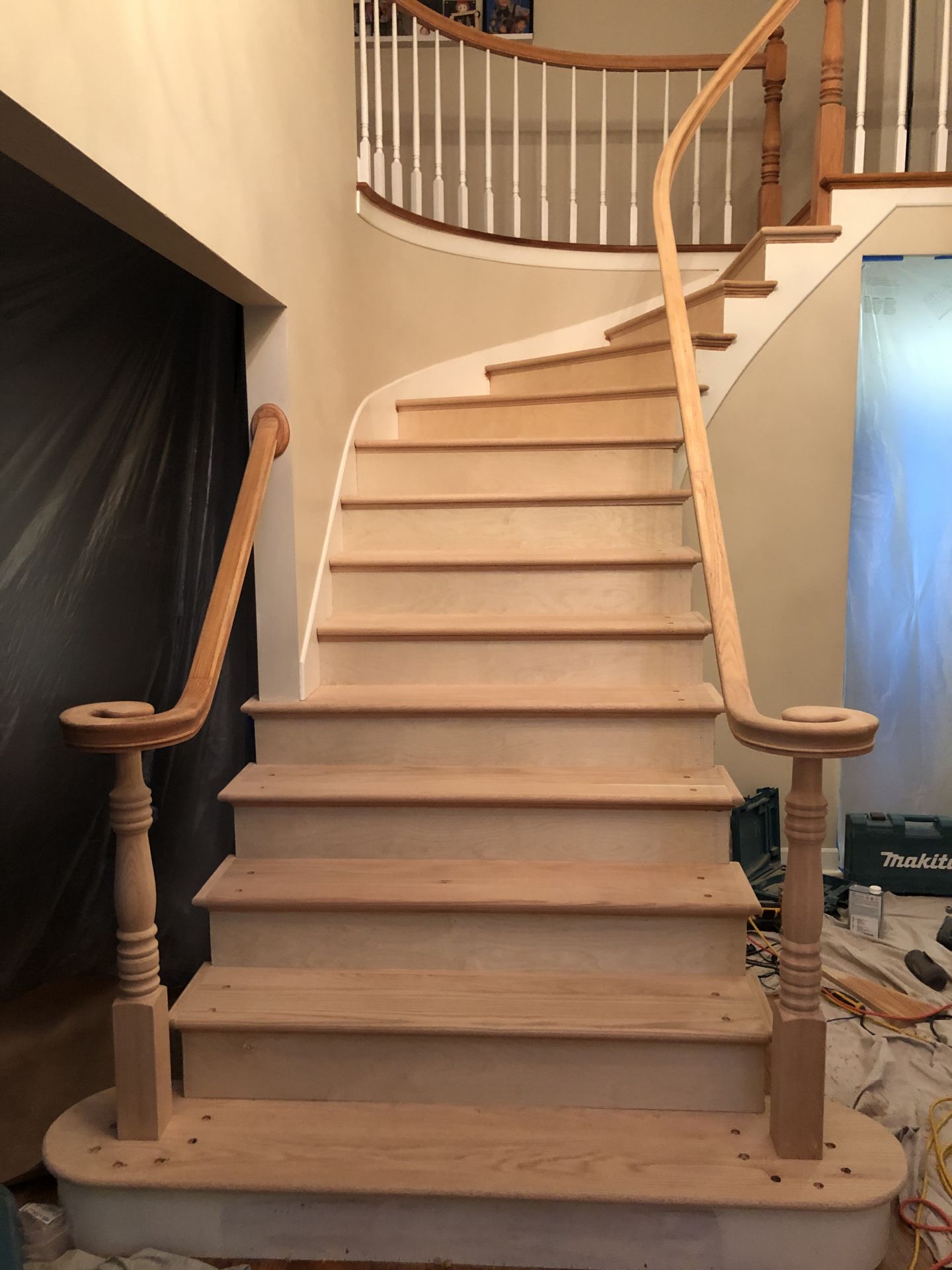 Curved oak staircase with natural wood treads refinished in Chicago by FLOORecki Floors & Stairs