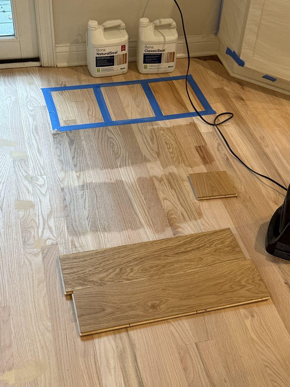 Bona NaturalSeal and ClassicSeal with stain test samples on a sanded red oak floor, Chicago refinishing project