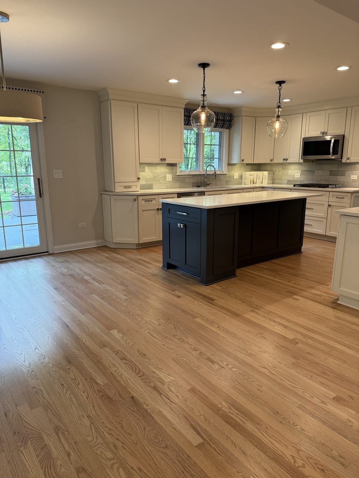 Freshly refinished red oak hardwood floor with natural matte finish in a Chicago suburb kitchen